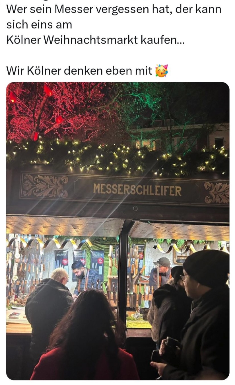 Kölner Weihnachtsmarkt Messerschleifer.jpg