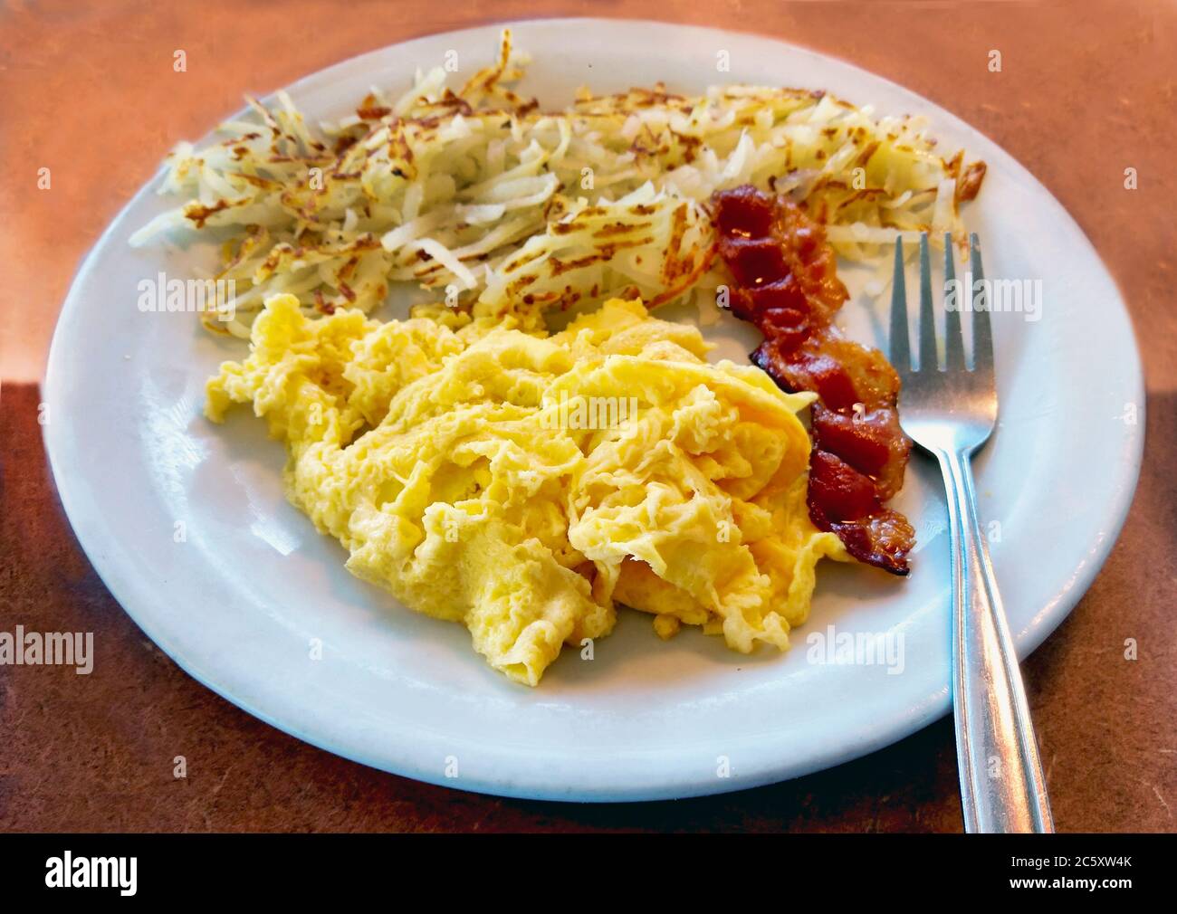 scrambled-eggs-with-bacon-and-a-side-of-crispy-hash-brown-potatoes-for-a-quick-and-hearty-brea...jpg
