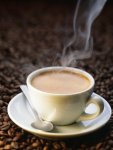 sapper-peter-a-steaming-cup-of-coffee-on-coffee-beans.jpg
